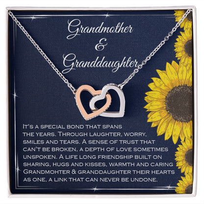 Grandmother and granddaughter sharing a moment with interlocking hearts necklace